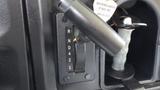 Gear shift panel of a 2015 International PC105 showing the gear selection and a key ignition switch