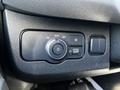 Control panel of a 2022 Mercedes-Benz Sprinter featuring a dial for headlight settings and various buttons for light functions