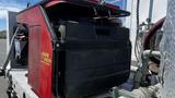 A 2006 Ford LCF 550 truck featuring a black toolbox with a red and black generator mounted on the side