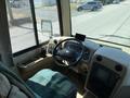 Interior view of a 2008 Newmar Canyon Star 36 Foot Class A Motorhome featuring a driver's seat dashboard and control panel with a cup holder and small screen