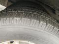 Close-up of a tire on a 2017 Chevrolet Express showing visible tread patterns and wear indicators