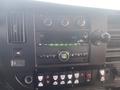 Dashboard of a 2017 Chevrolet Express featuring climate controls audio system and various buttons for operational features