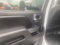 Interior door handle and control panel of a 2015 Chevrolet Silverado 3500HD