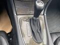 The gear shift lever of a 2007 Mercedes-Benz E-Class with a leather boot and a panel indicating gears P R N D