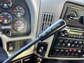 A gear shift lever labeled NOT FOR PARKING in the cab of a 2013 International DuraStar 4300 truck