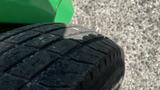 Close-up of the tire of a 2017 Laymor SweepMaster 300 showing tread pattern and wear