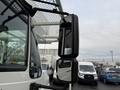 A side mirror of a 2007 International 4200 truck with a metal frame and clear reflective surface