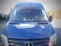 A blue 2017 Mercedes-Benz Sprinter van viewed from the front with a prominent Mercedes logo on the grille and distinct headlights