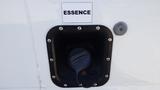 A fuel filler cap for a 2015 Ford Econoline labeled with the word ESSENCE