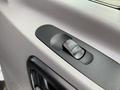 Close-up of the window control switch on the door panel of a 2017 Mercedes-Benz Sprinter