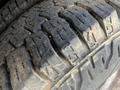 Close-up of a worn tire tread from a 2012 Ford Econoline showing distinct patterns and grooves