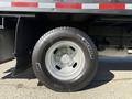 Close-up of a 2016 Ford F-350 SD wheel showing the silver alloy rim and Michelin tire