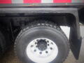 Close-up of a tire on a 2008 International 7400 truck featuring a shiny metal rim and a Goodyear tire brand visible on the tread