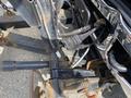Close-up view of the undercarriage of a 2010 Ford F-550 showing various metal components including a hitch and wiring connections