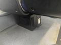 A black metal box with ventilation holes placed under a seat in a 2017 Chevrolet Express