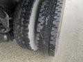 Close-up of two tires on a truck showing different tread patterns and textures