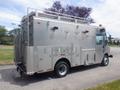 A 2007 Morgan Olson Workhorse W42 with a metallic body equipped with multiple compartments and emergency lights on the roof