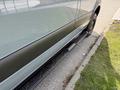 A 2019 Mercedes-Benz Sprinter van captured from the side showcasing its sleek design and running board