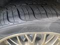 Close-up of a tire of a 1966 Ford Mustang showing tread patterns and alloy rim details