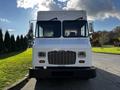 A white 2017 Freightliner M Line truck facing directly towards the viewer with large windows and a prominent grill design