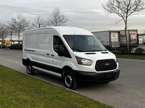 A white 2017 Ford Transit van with a sleek design and large cargo space featuring a black grille and front bumper