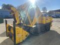 A yellow 2008 Camoplast SW 4S snow blower with a cab and tracks positioned at an angle with a snow chute in front