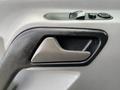 A close-up view of the door handle of a 2017 Mercedes-Benz Sprinter showing a sleek design and control buttons for windows and locks