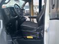 Interior of a 2017 Chevrolet Express showing the driver's seat and dashboard with steering wheel and controls