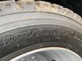 The image shows a close-up of a tire with the size 22570R19.5 and the text Made in China on the sidewall