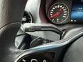 Close-up of the steering wheel and control lever in a 2019 Mercedes-Benz Sprinter showing the dashboard and speedometer