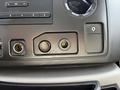Control panel of a 2019 Ford Econoline featuring audio knobs buttons and input ports