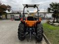 A 2001 Agco ST40 tractor seen from the rear featuring large rear tires a flat top and a visible hitch attachment