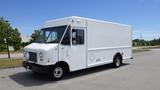 White 2011 Ford Econoline delivery truck with a boxy shape and front-facing windows parked in a lot