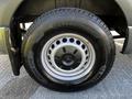Close-up of a wheel from a 2021 Mercedes-Benz Sprinter featuring a silver alloy rim and a Michelin tire with visible tread pattern