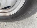 Close-up of a Michelin tire mounted on a wheel of a 2017 Chevrolet Express showing the tread pattern and brand logo