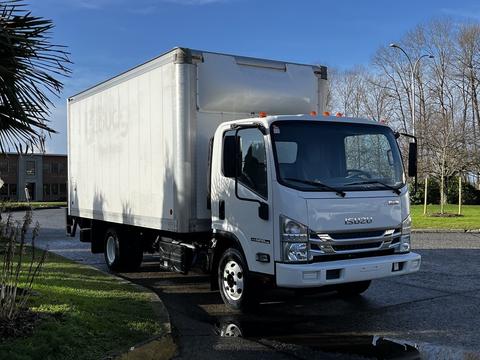 A 2020 Isuzu NPR work truck with a white box cargo body and a front cab, featuring orange clearance lights on top of the cab