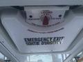 Emergency exit latch with instructions in English and French for a Chevrolet Express 2017