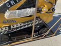 A 2024 AGT KTT23 Mini Skid Steer with tracks and a protective grip covered in bubble wrap