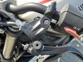 A close-up of the clutch lever and control switch on a 2018 Triumph Street Triple RS motorcycle