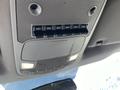 Overhead control panel of a 2019 Ford F-350 SD featuring multiple auxiliary switches and overhead lights