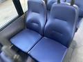 A pair of blue vinyl seats from a 2017 Chevrolet Express van