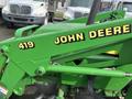 A green and yellow 2003 John Deere 790 tractor with the number 419 displayed prominently on its front arm