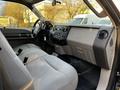 Interior view of a 2008 Ford F-250 SD showing the front seats and dashboard with controls and features