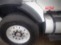 2008 International 7400 truck with a prominent diesel fuel sign and a close-up view of the tire and wheel assembly