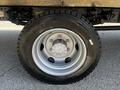 A close-up of a silver and black tire mounted on a 2020 Hino 195 with visible tread and rim details