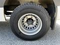 Close-up of a silver wheel and tire of a 2022 Mercedes-Benz Sprinter featuring a continental tire and a six-bolt pattern