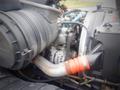 A close-up view of the engine compartment of a 2006 International 4300 featuring the air intake and various engine components