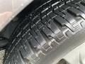 Close-up of a tire on a 2013 Toyota Sienna showing tread pattern and texture