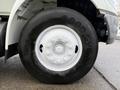 A close-up of the tire and wheel of a 2007 International 4200 showing a Goodyear tread with visible lug nuts and rim details