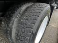Close-up of two rear tires on a 2008 Ford F-750 showing tread pattern and sidewalls